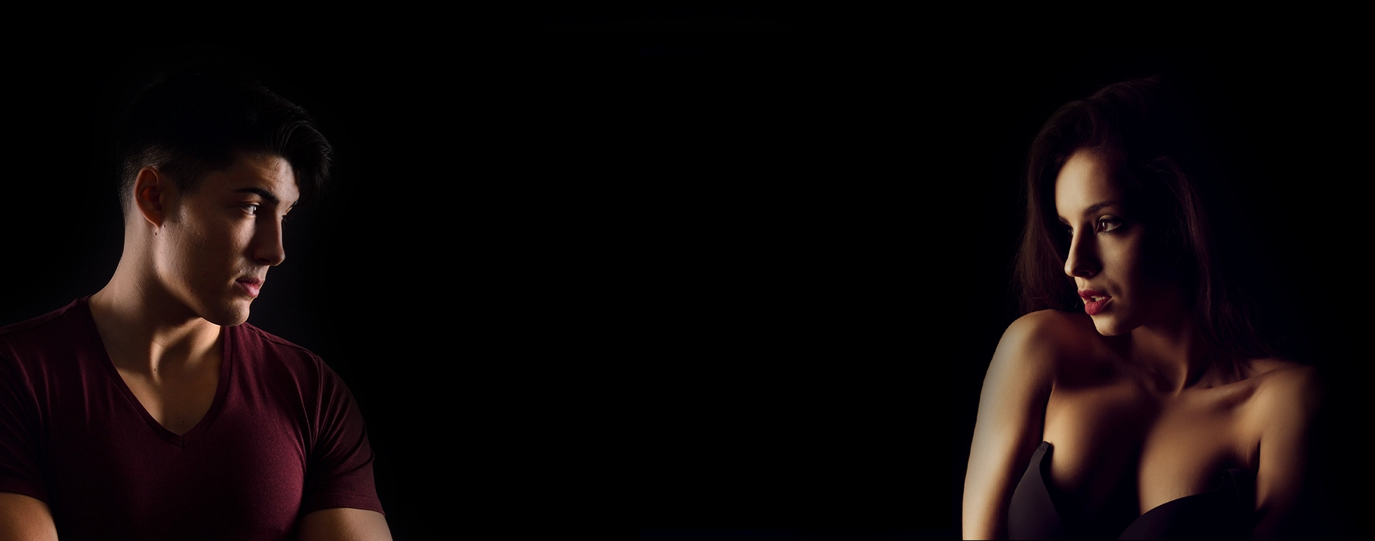 A beautiful Asian escort laying seductively on a sofa